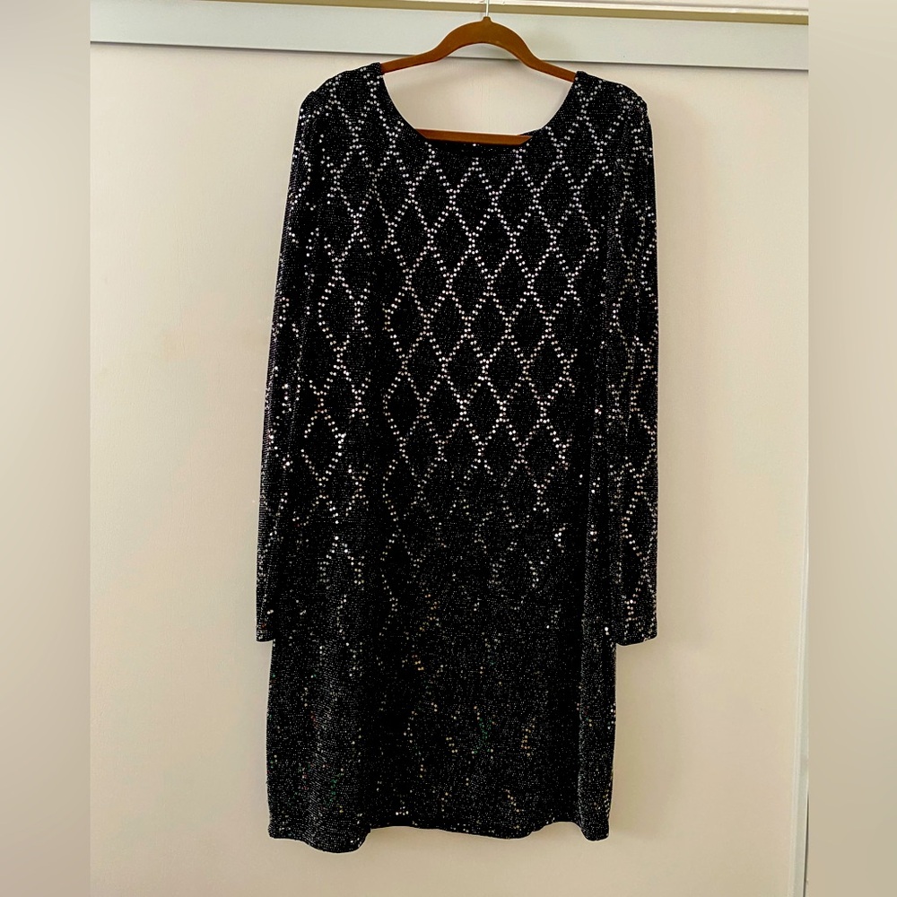 Vintage black sparkly dress size 18-20, knee high with a little puff sleeve.